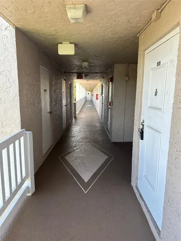 a view of gallery with wooden floor