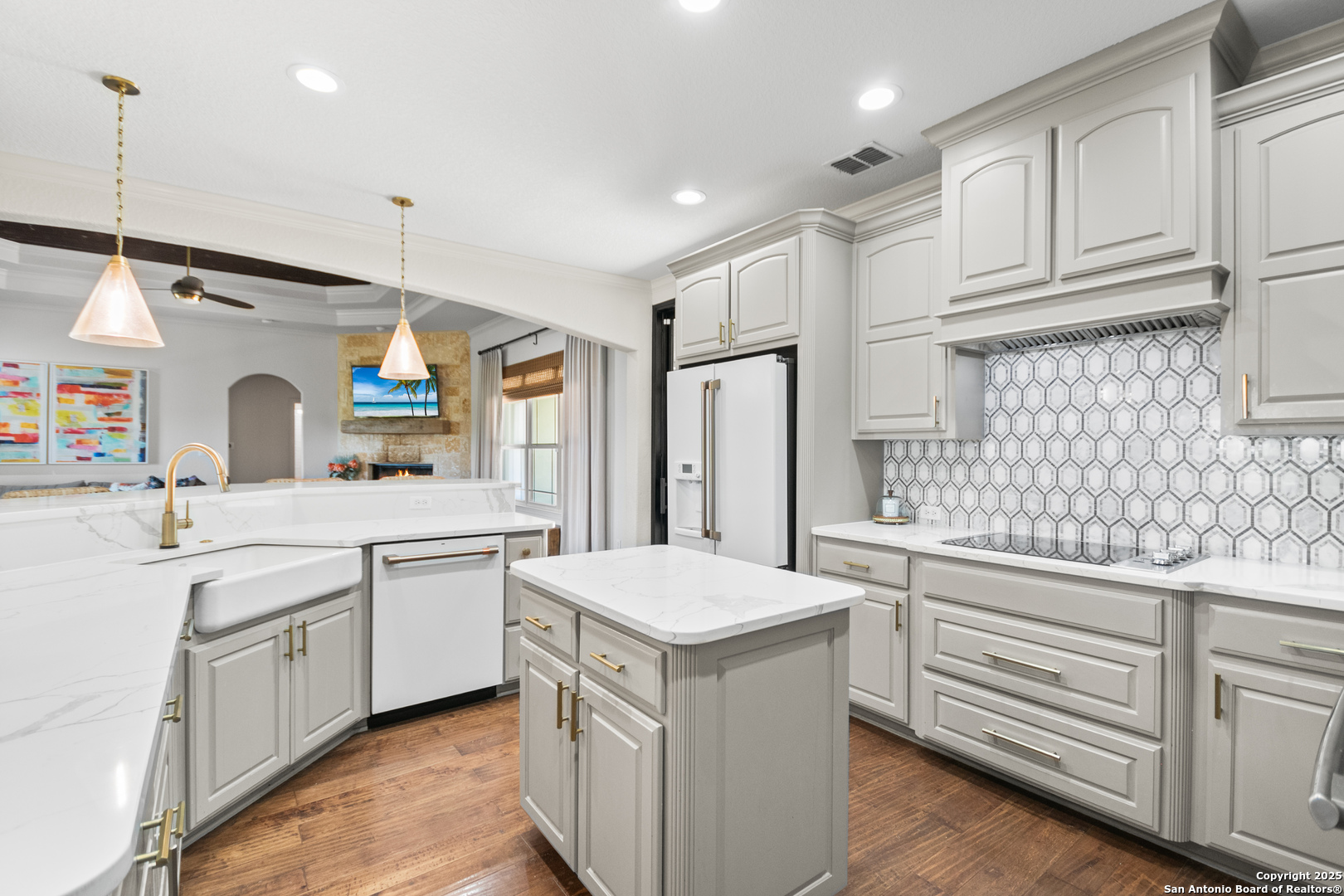 875 Shepherds Ranch Bulverde, TX 78163 - Photo 18 of 54 a kitchen with granite countertop a sink stainless steel appliances and white cabinets