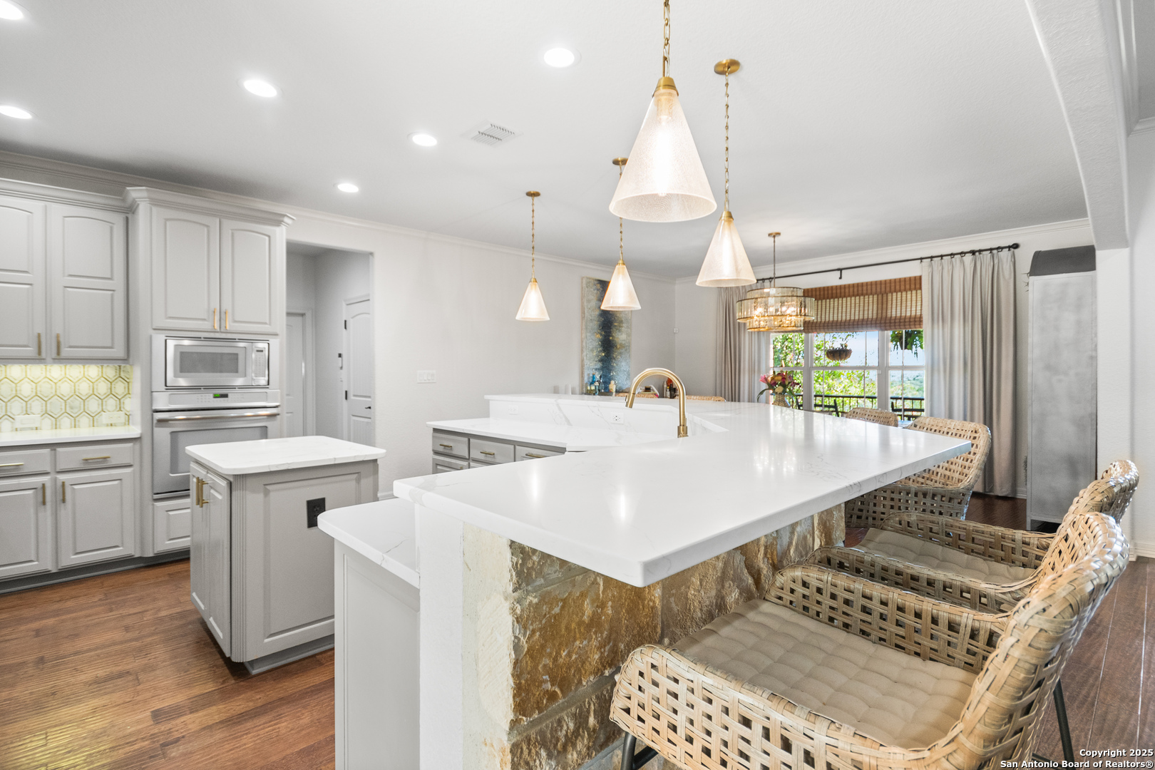 875 Shepherds Ranch Bulverde, TX 78163 - Photo 21 of 54 a kitchen with stainless steel appliances a sink a stove a refrigerator cabinets and living room view