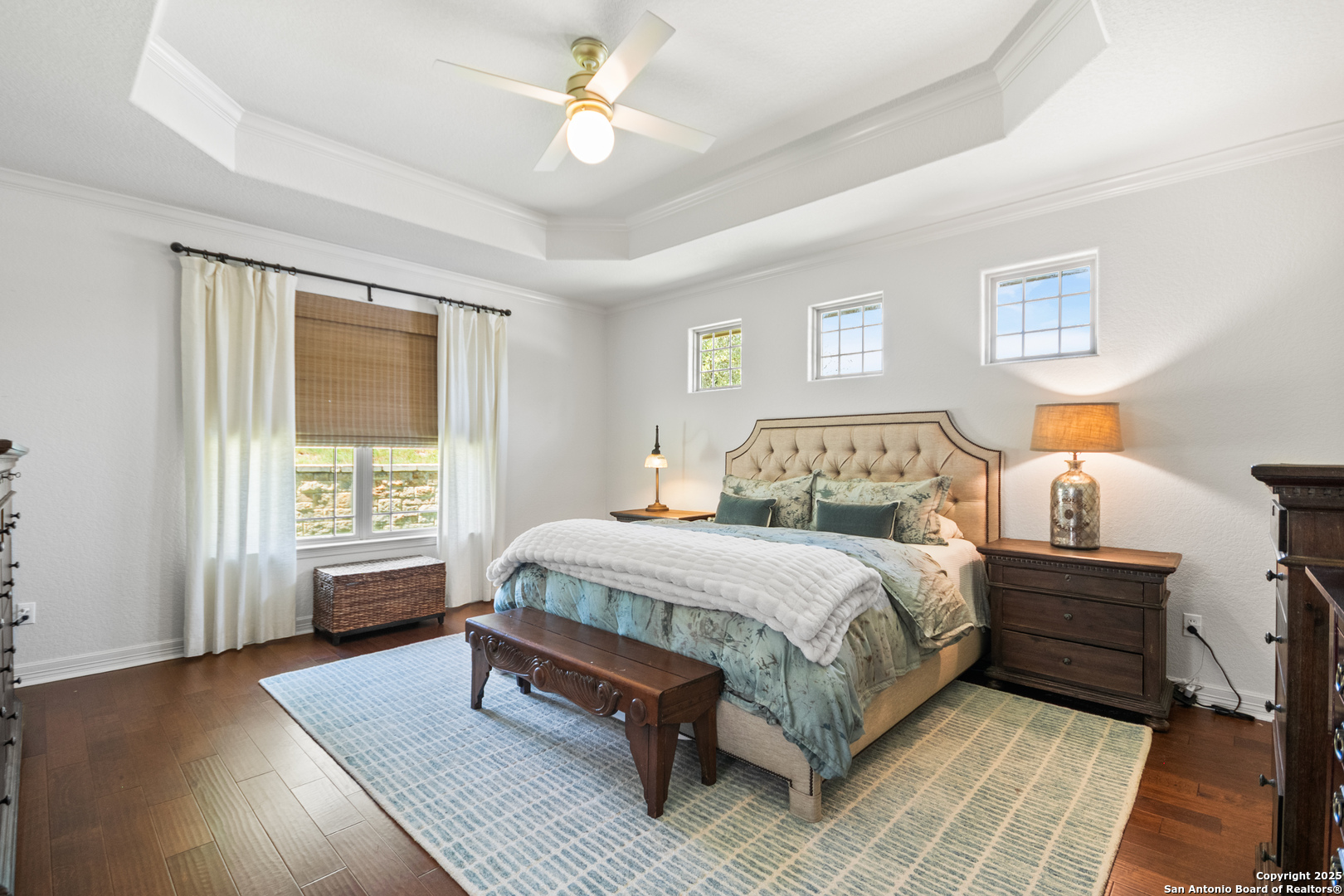 875 Shepherds Ranch Bulverde, TX 78163 - Photo 27 of 54 a bedroom with a large bed wooden floor and window