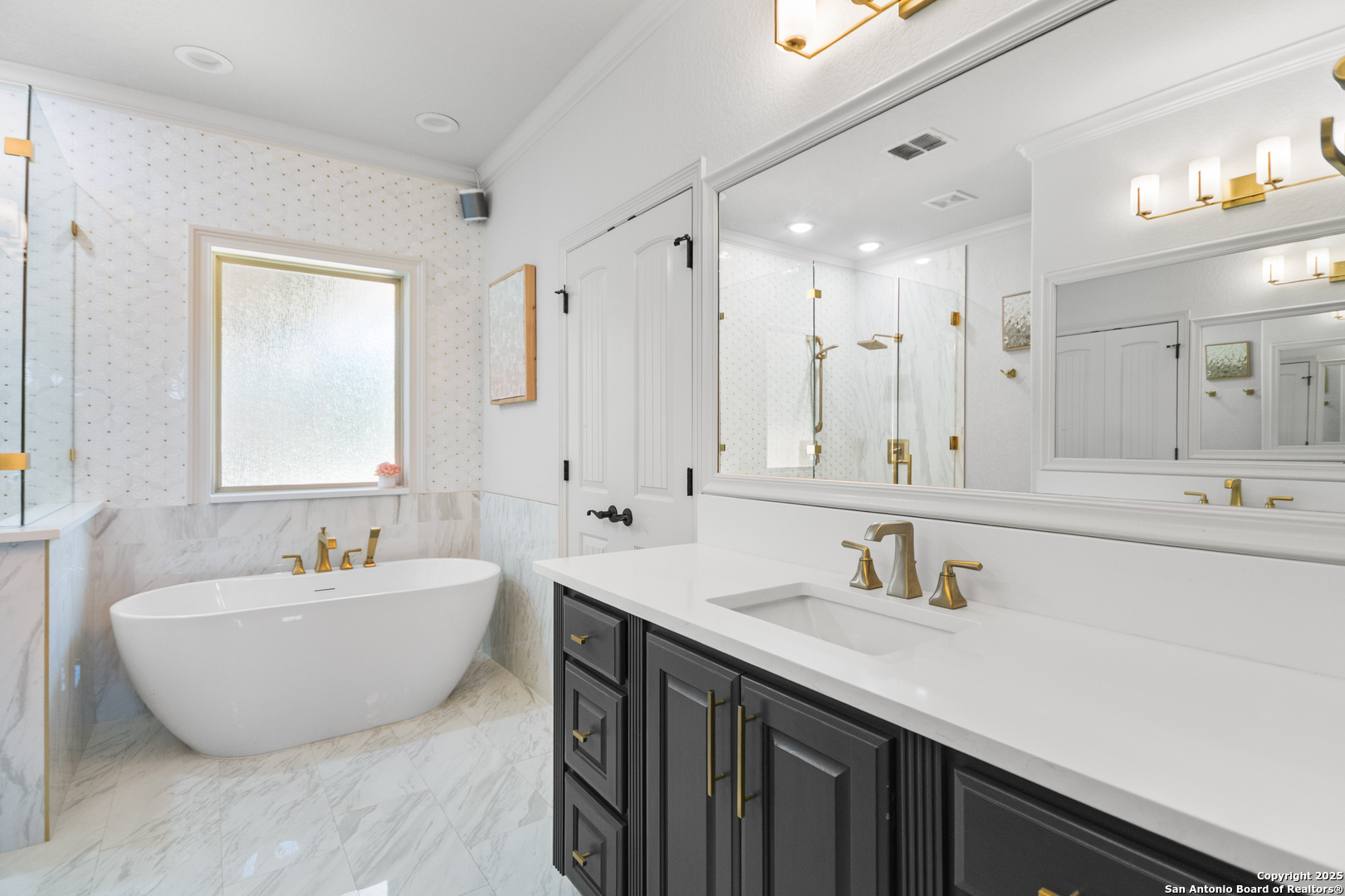 875 Shepherds Ranch Bulverde, TX 78163 - Photo 29 of 54 a spacious bathroom with a double vanity sink mirror and bathtub