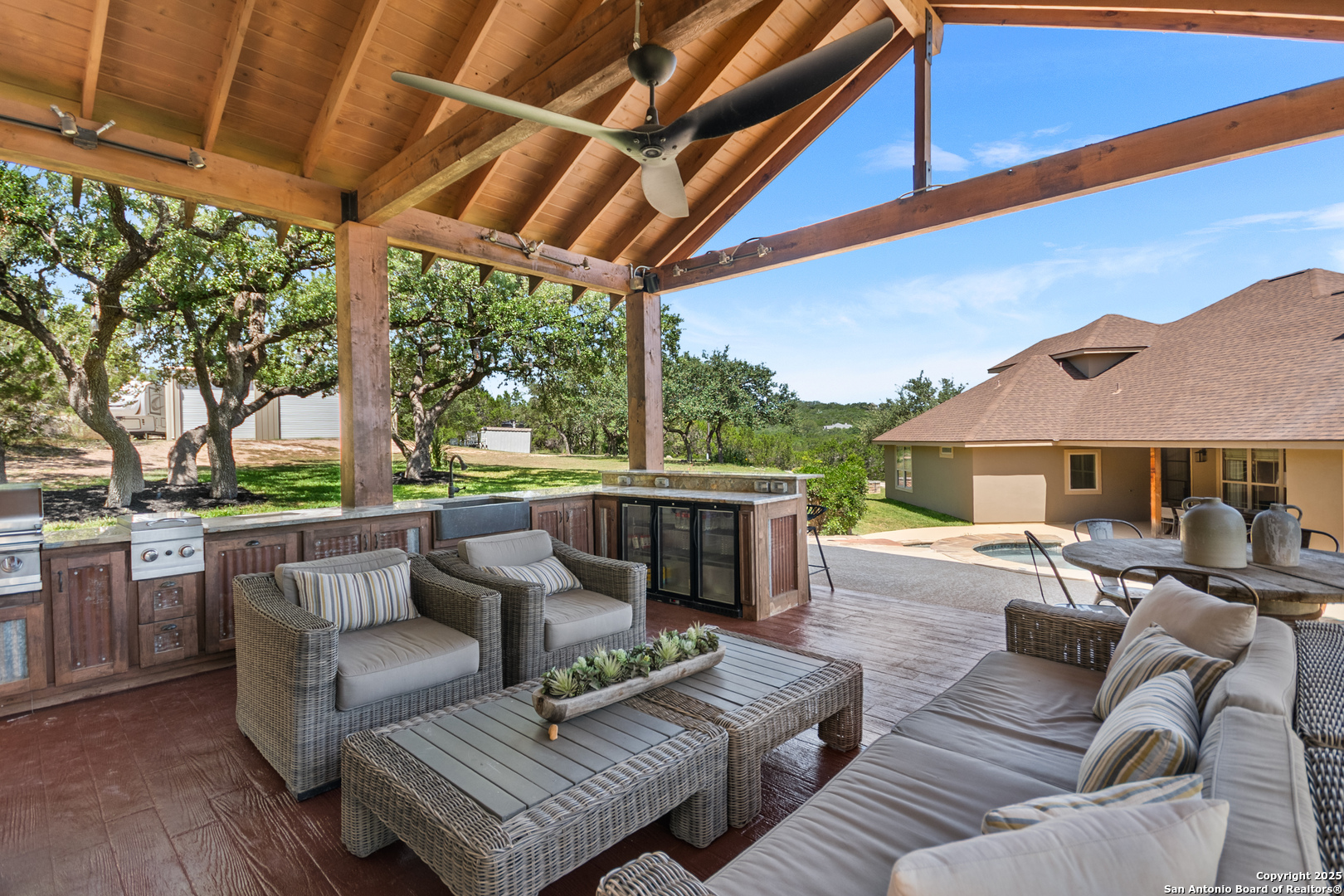 875 Shepherds Ranch Bulverde, TX 78163 - Photo 42 of 54 a outdoor living space with patio furniture and a fireplace
