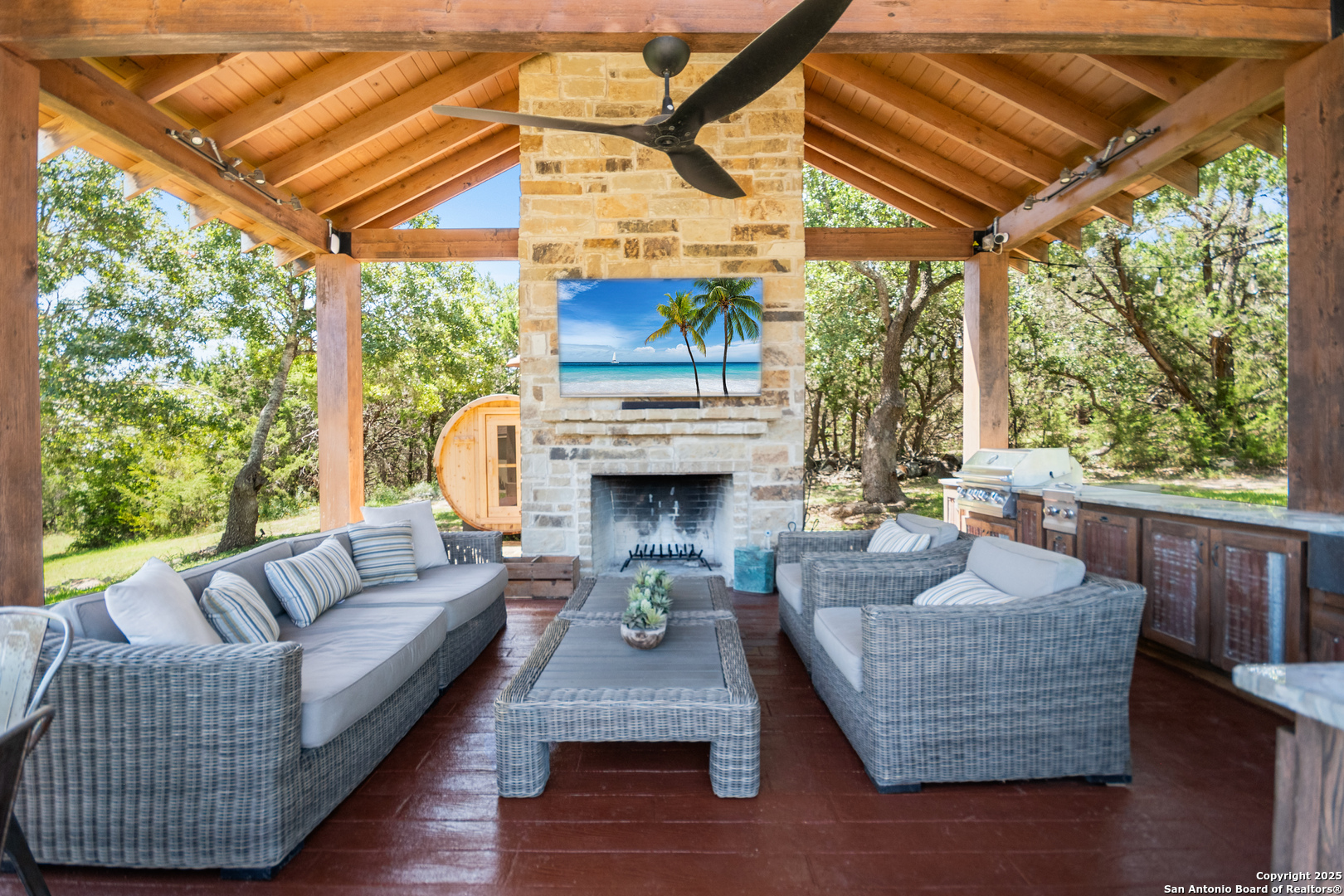875 Shepherds Ranch Bulverde, TX 78163 - Photo 45 of 54 a living room with furniture and a fireplace