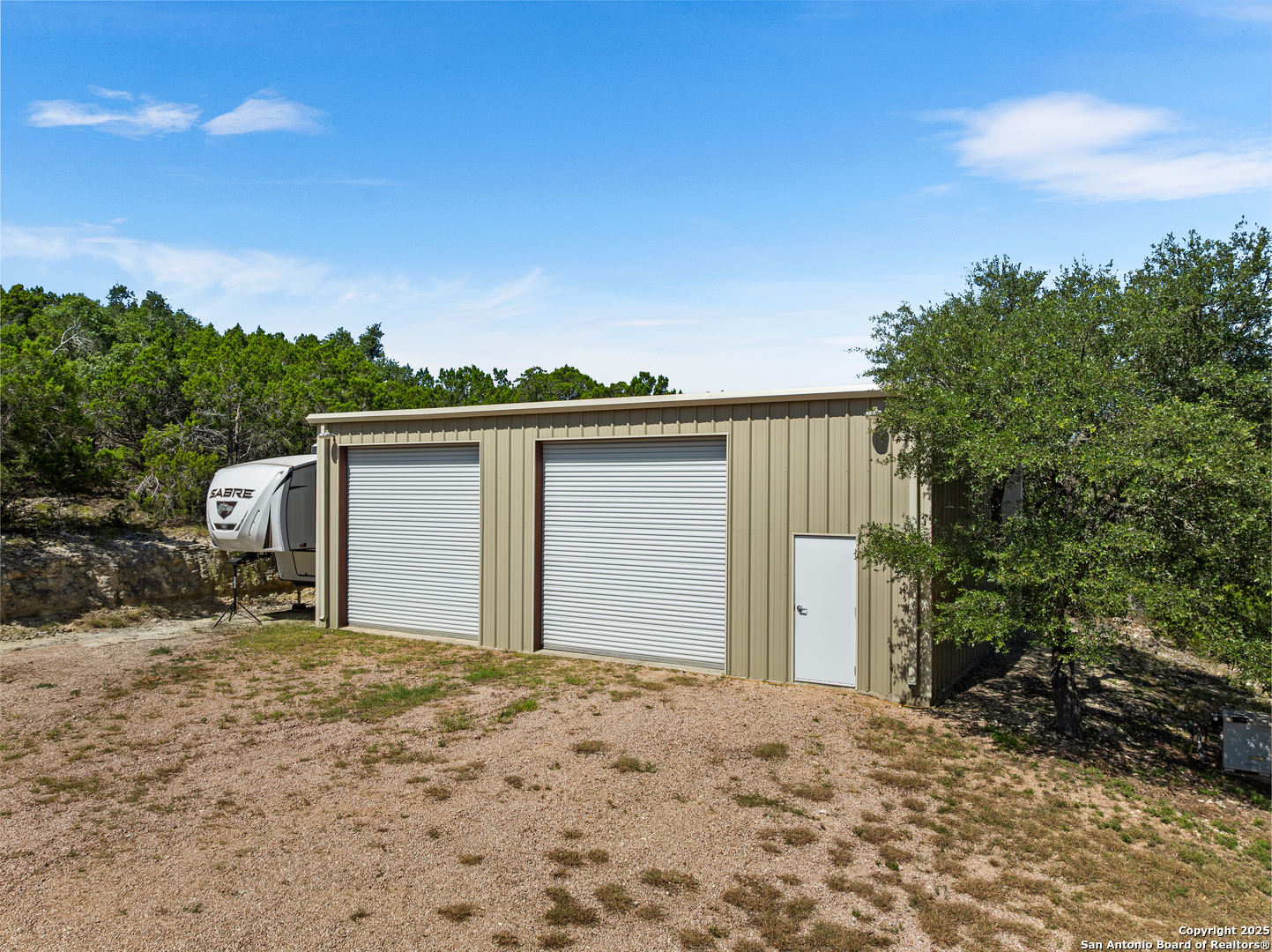 875 Shepherds Ranch Bulverde, TX 78163 - Photo 48 of 54 a view of a house with a backyard