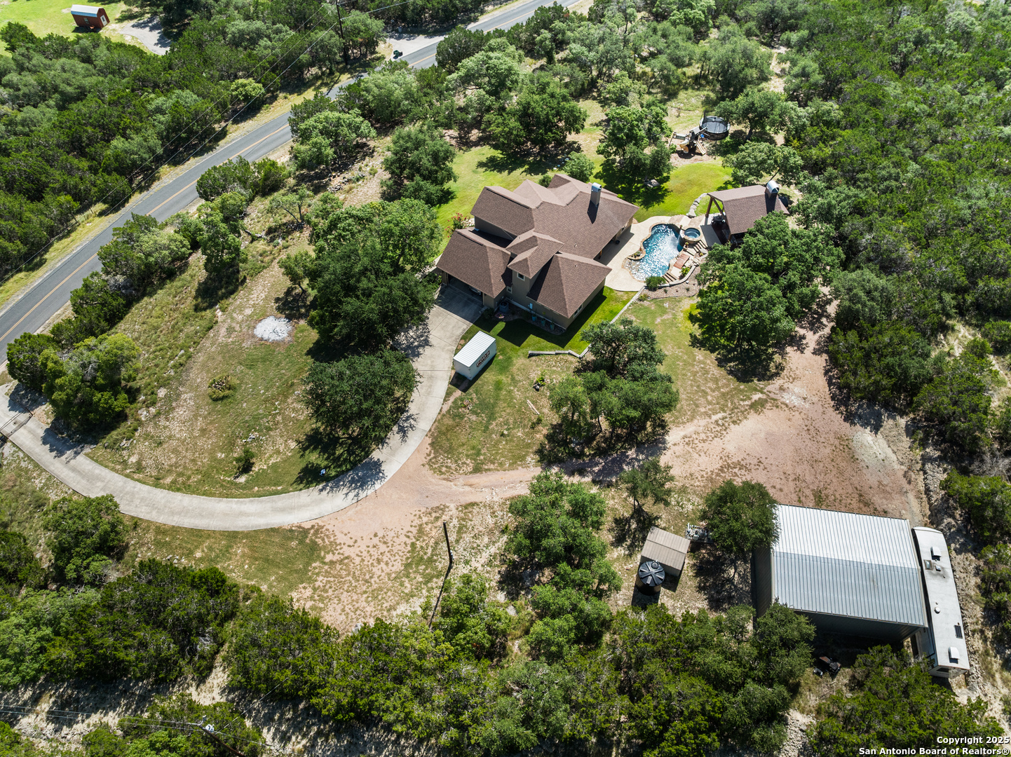 875 Shepherds Ranch Bulverde, TX 78163 - Photo 50 of 54 an aerial view of a house with a yard