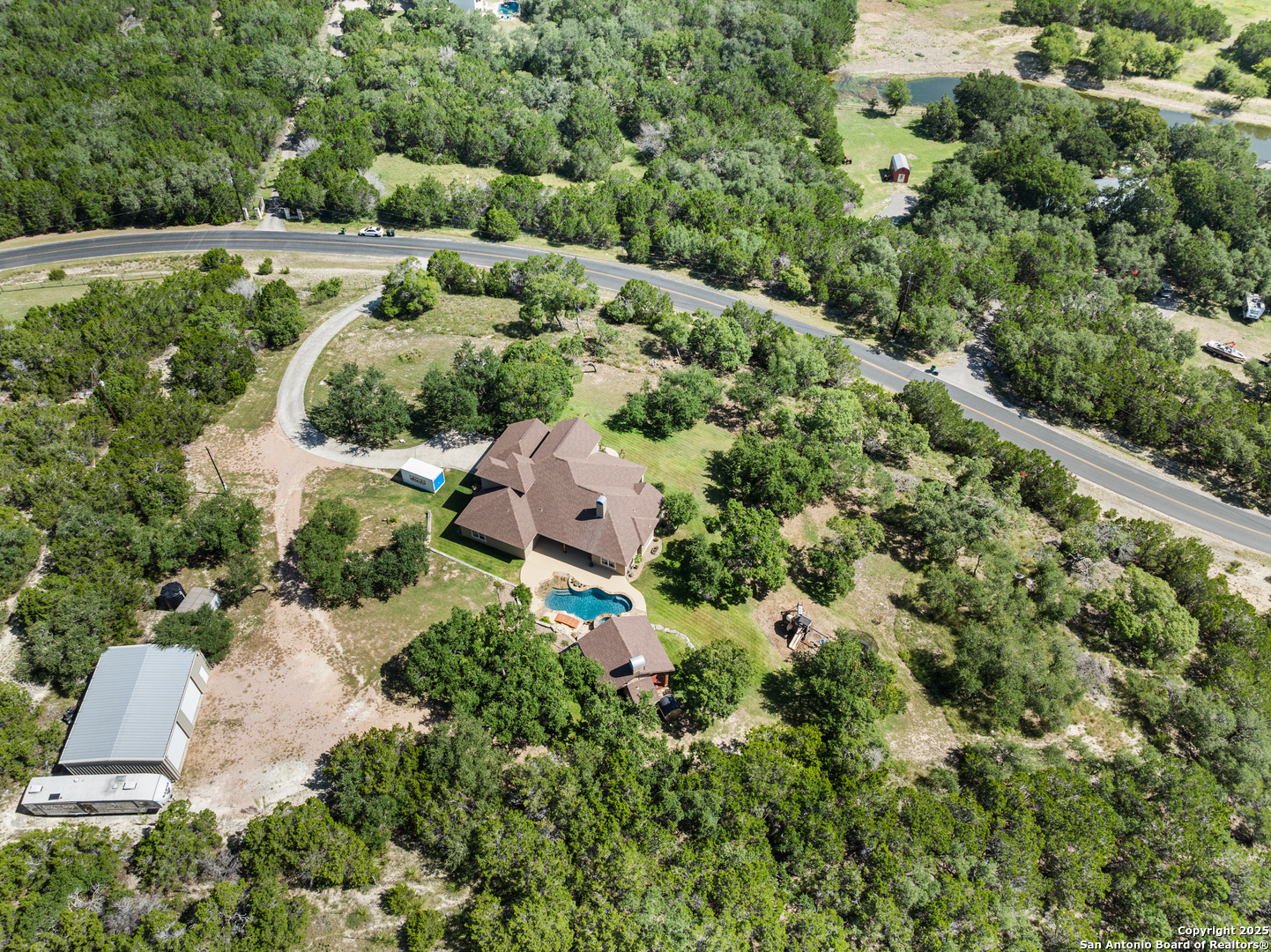 875 Shepherds Ranch Bulverde, TX 78163 - Photo 51 of 54 an aerial view of a house with a yard and outdoor seating