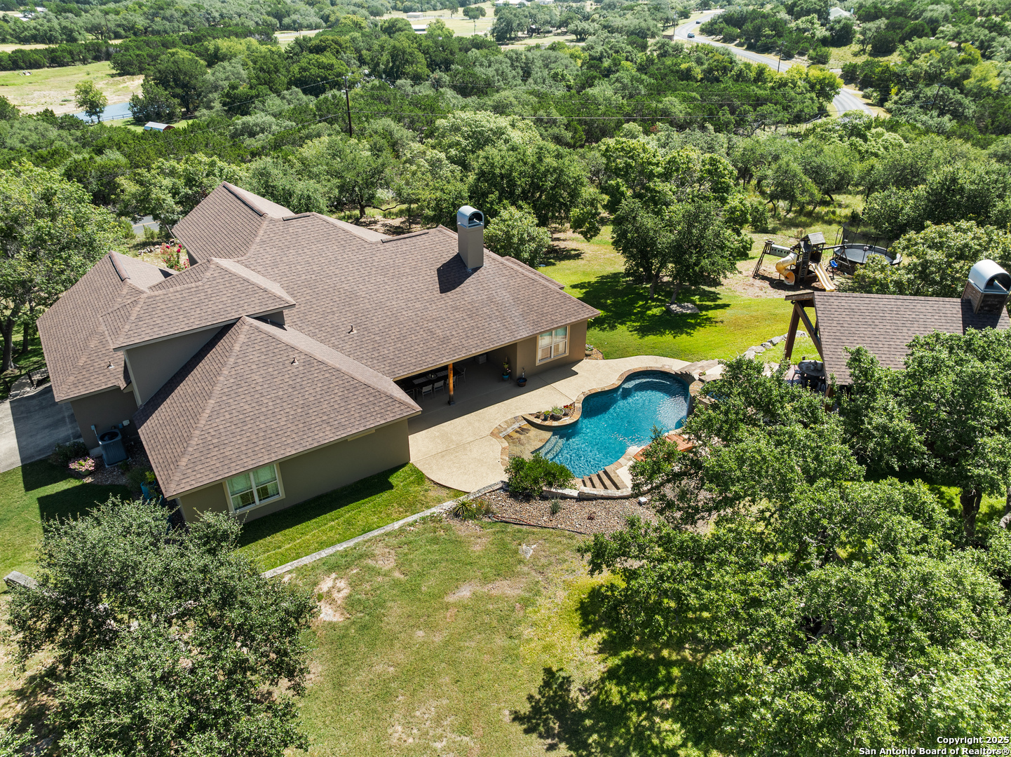 875 Shepherds Ranch Bulverde, TX 78163 - Photo 53 of 54 an aerial view of a house with yard swimming pool and outdoor seating