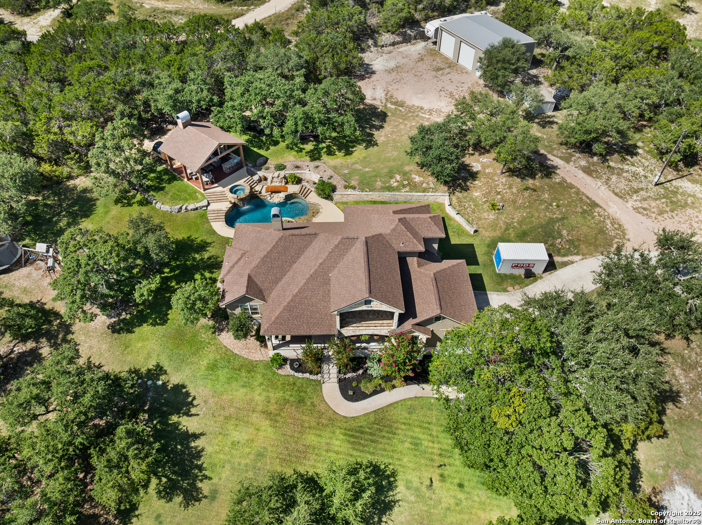 875 Shepherds Ranch Bulverde, TX 78163 - Photo 7 of 54 an aerial view of a house with yard swimming pool and outdoor seating