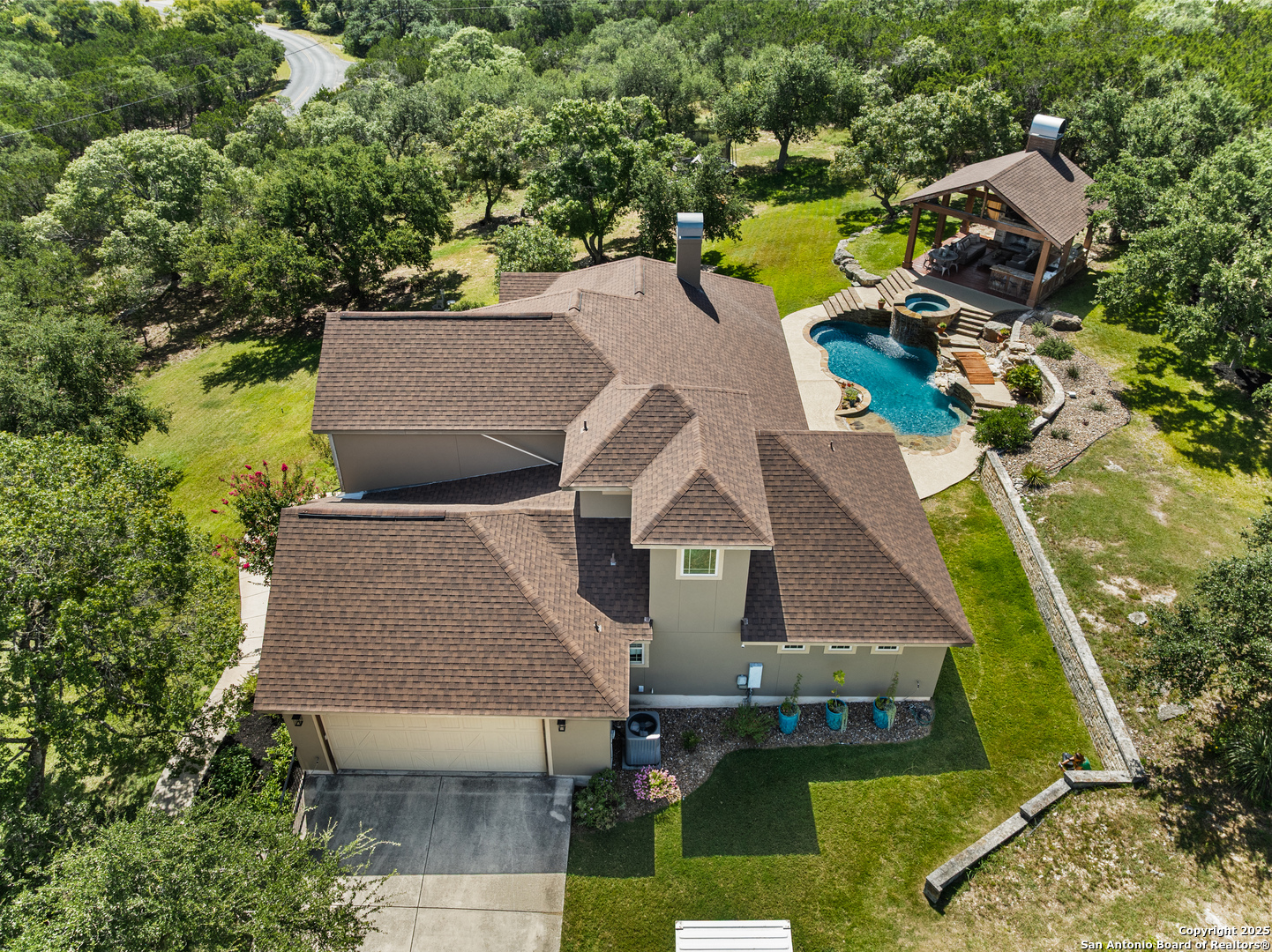 875 Shepherds Ranch Bulverde, TX 78163 - Photo 8 of 54 an aerial view of a house with a garden