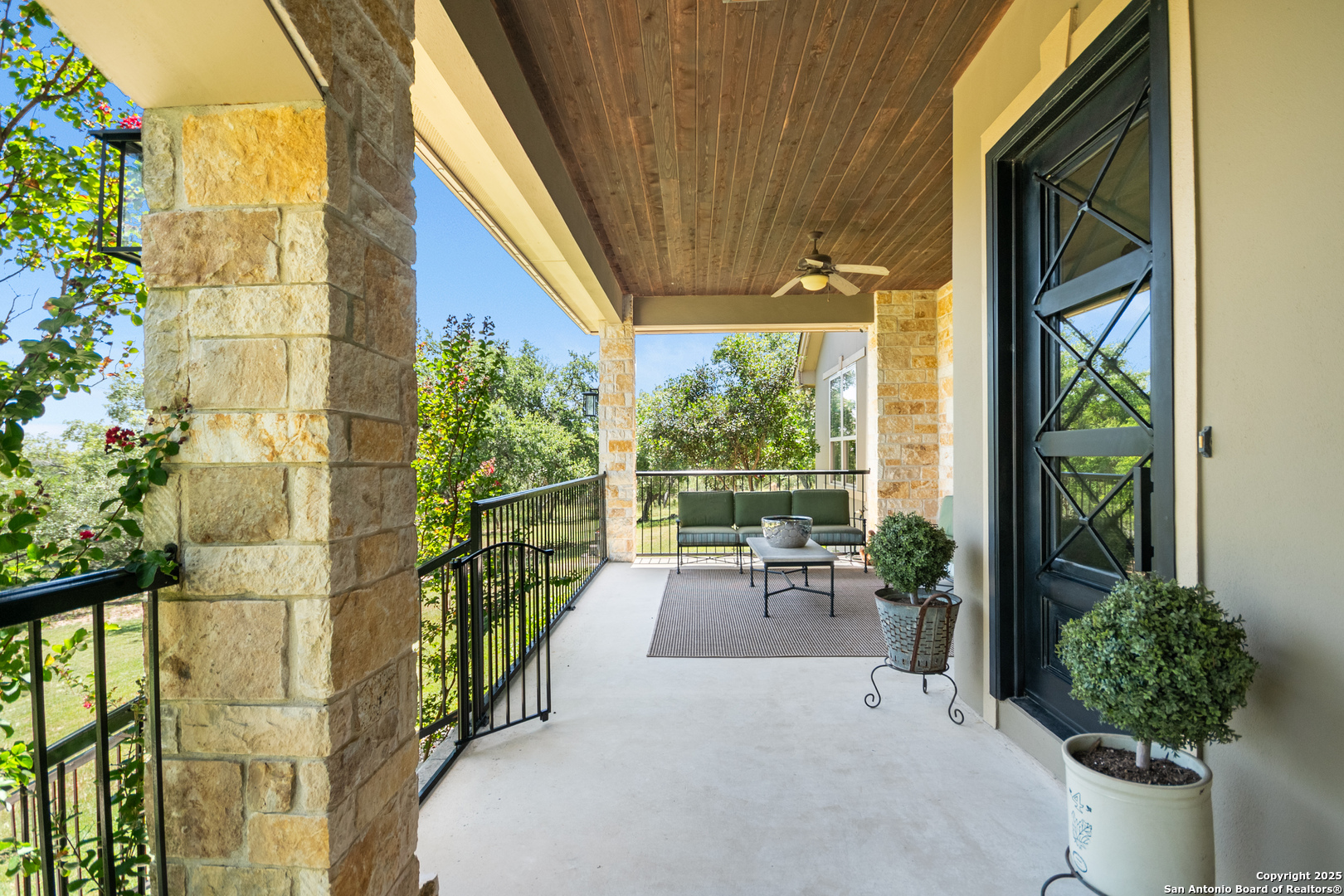 875 Shepherds Ranch Bulverde, TX 78163 - Photo 9 of 54 a balcony with chairs and potted plants