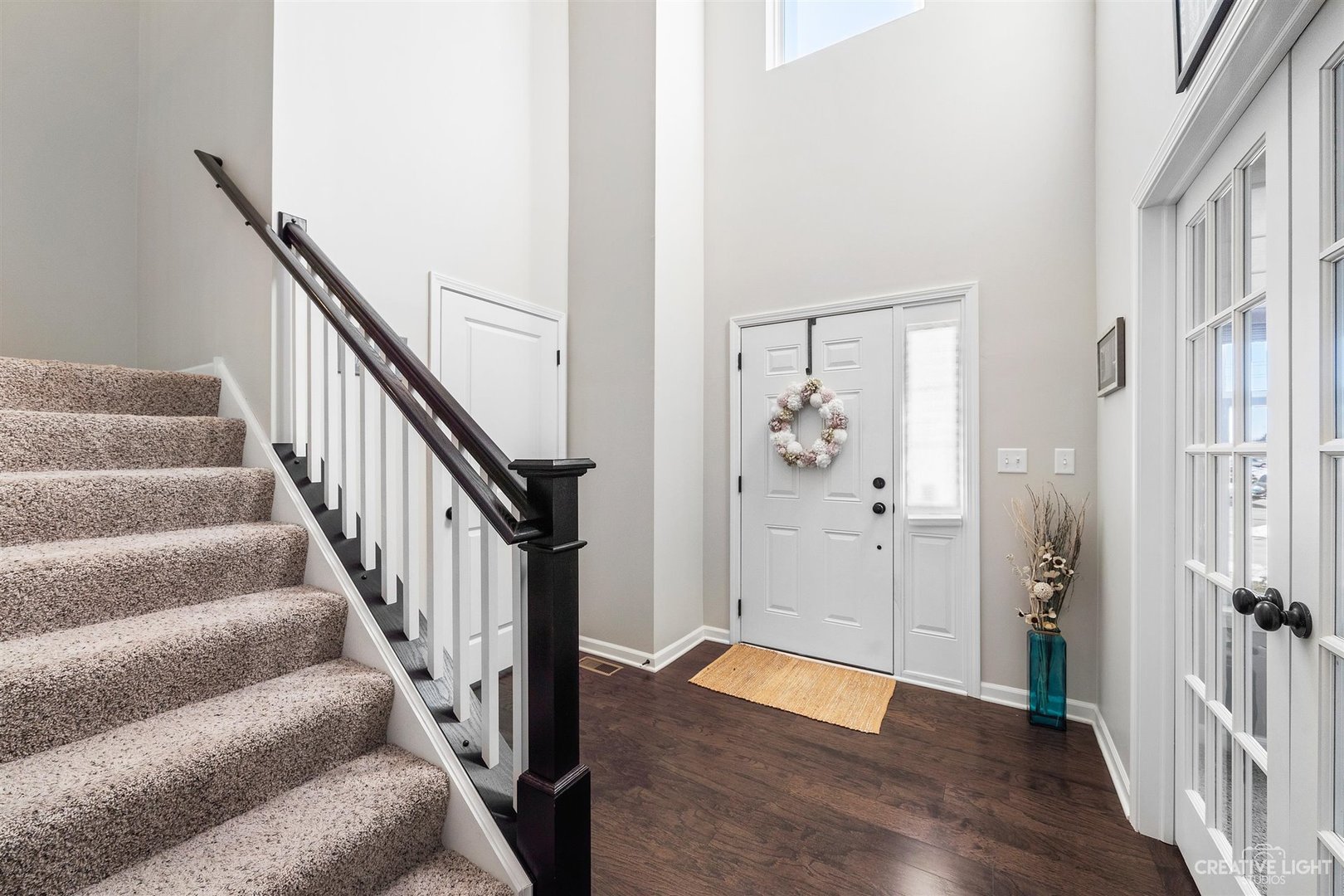 3806 Monterey Circle Algonquin, IL 60102 - Photo 13 of 33 a view of entryway with wooden floor and stairs