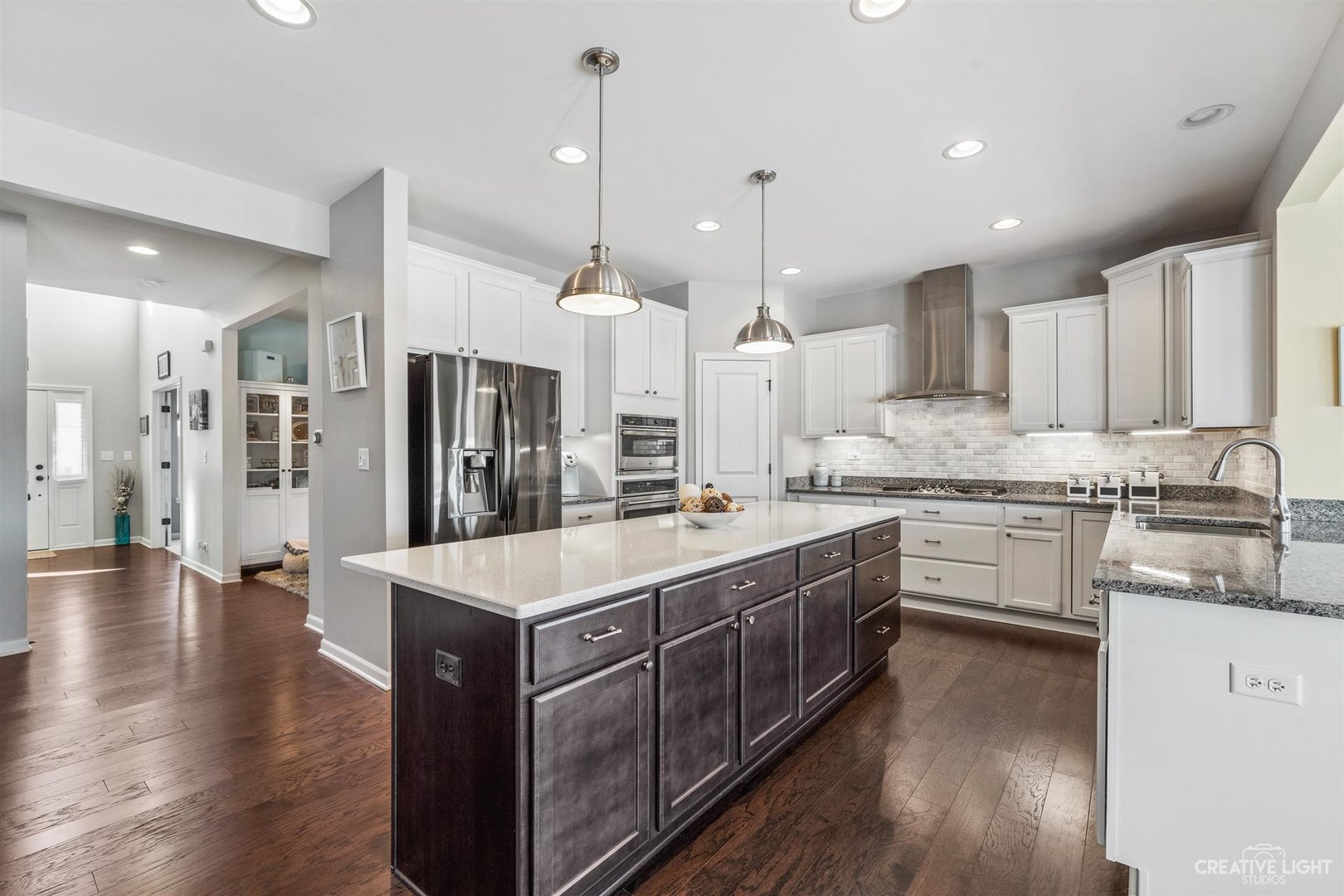 3806 Monterey Circle Algonquin, IL 60102 - Photo 3 of 33 a large kitchen with stainless steel appliances kitchen island granite countertop a large center island attached withe living room