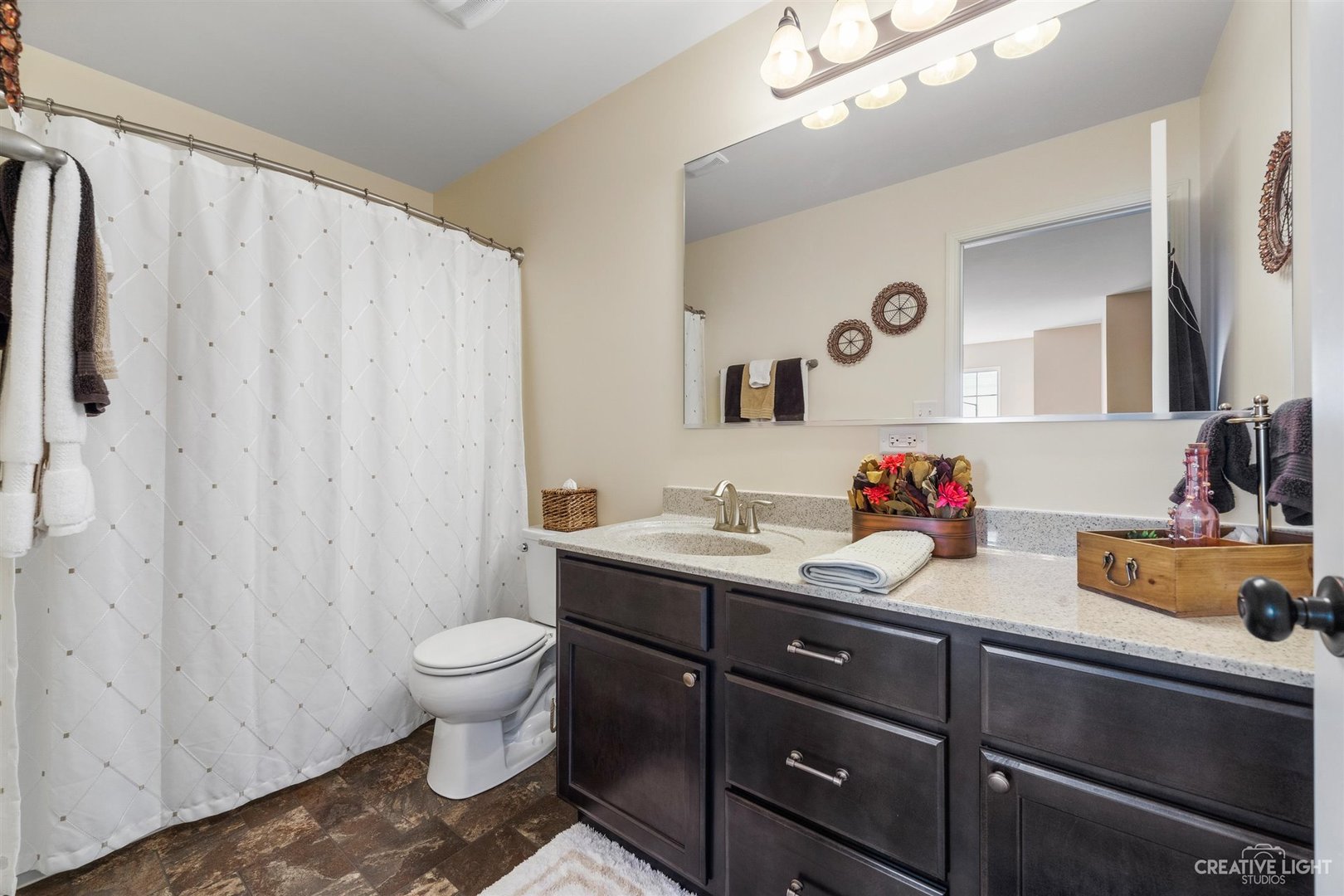 3806 Monterey Circle Algonquin, IL 60102 - Photo 21 of 33 a bathroom with a granite countertop sink and a toilet