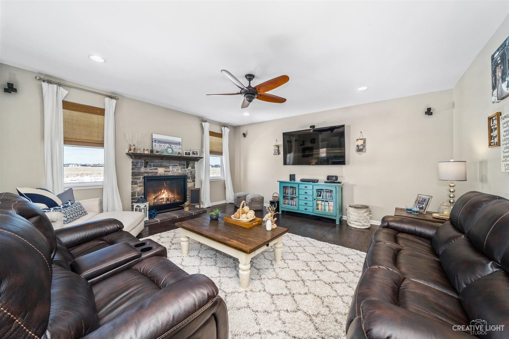 3806 Monterey Circle Algonquin, IL 60102 - Photo 8 of 33 a living room with furniture a flat screen tv and a fireplace