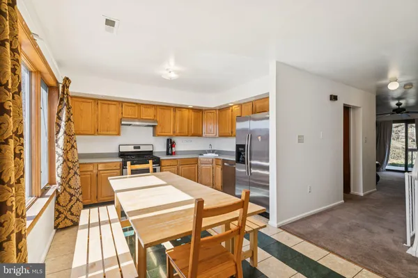 a kitchen with a sink appliances and cabinets
