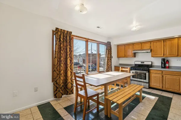 a view of a room with furniture and wooden floor