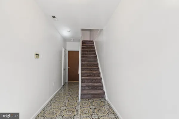 a view of hallway with stairs and stairs