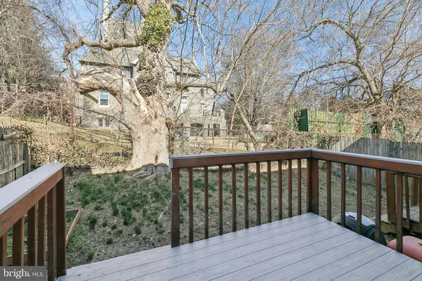 a view of backyard with a deck