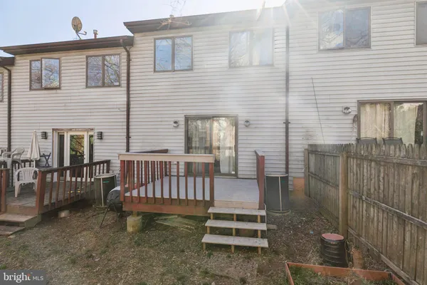 a view of a hallway with wooden shelves