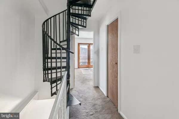 a view of an empty room and fire place