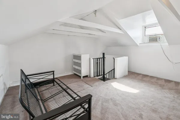 a view of livingroom with furniture and windows