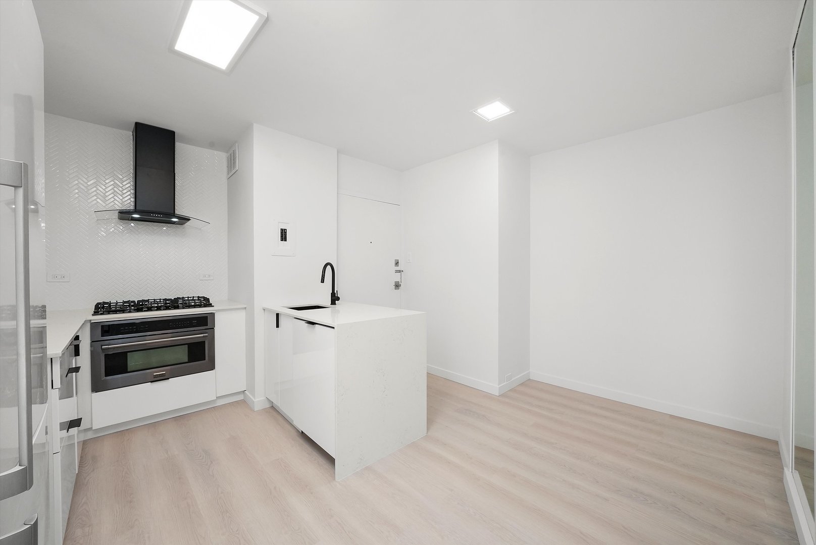 247 East Chestnut Street, Unit 2004 Chicago, IL 60611 - Photo 11 of 16 a view of kitchen with stainless steel appliances a stove top oven