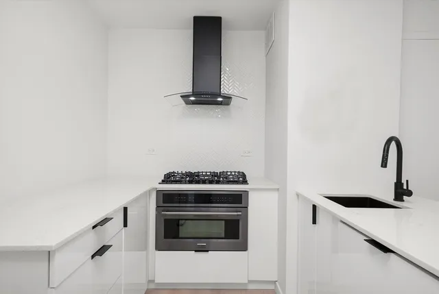 a kitchen with a stove and a microwave