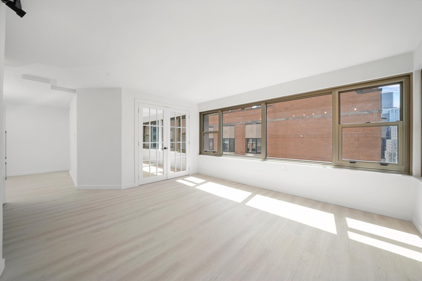 247 East Chestnut Street, Unit 2004 Chicago, IL 60611 - Photo 4 of 16 a view of an empty room with a window