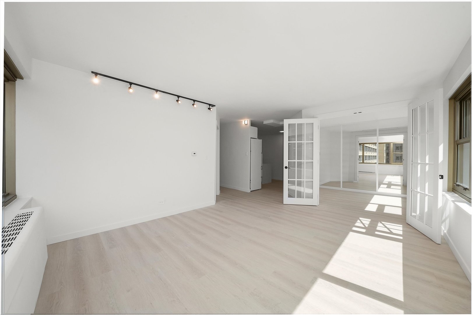 247 East Chestnut Street, Unit 2004 Chicago, IL 60611 - Photo 5 of 16 a view of a big room with closet and windows