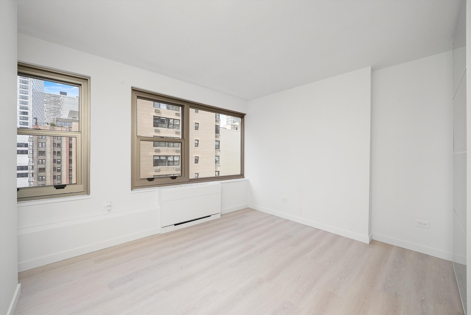 247 East Chestnut Street, Unit 2004 Chicago, IL 60611 - Photo 6 of 16 an empty room with windows