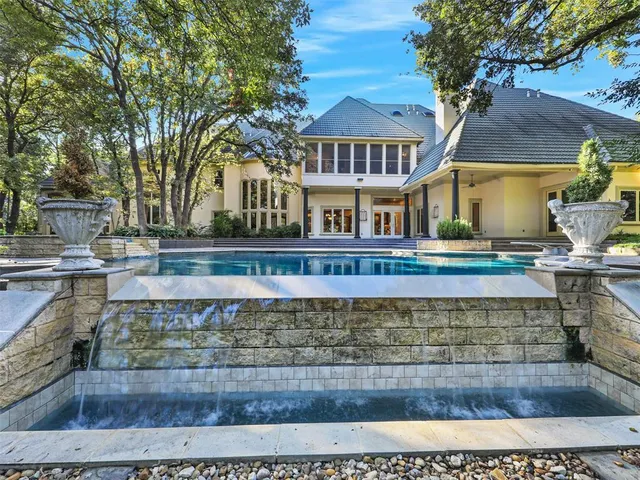 a large building with trees in front of it