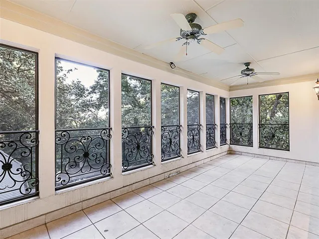 a view of an empty room with windows