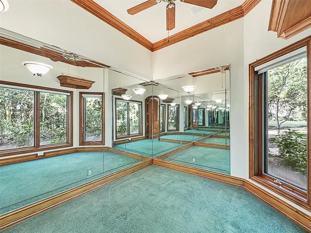 a large bathroom with a tub a sink and a large mirror