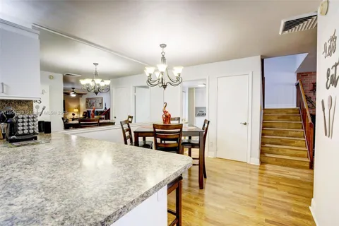 a kitchen with granite countertop stainless steel appliances and sink