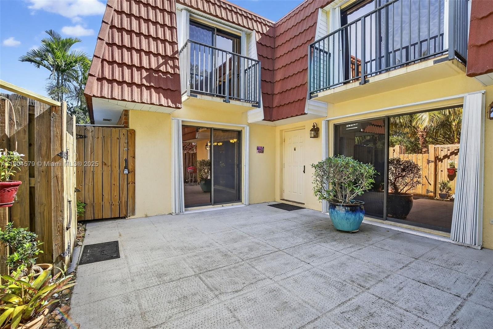 9927 Northwest 6th Place Plantation, FL 33324 - Photo 3 of 43 a view of a building with potted plants
