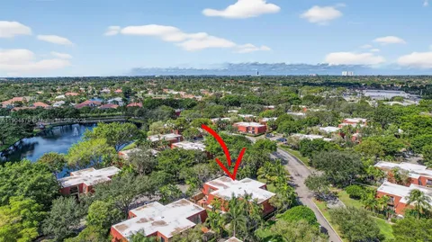 an aerial view of residential house with outdoor space and trees