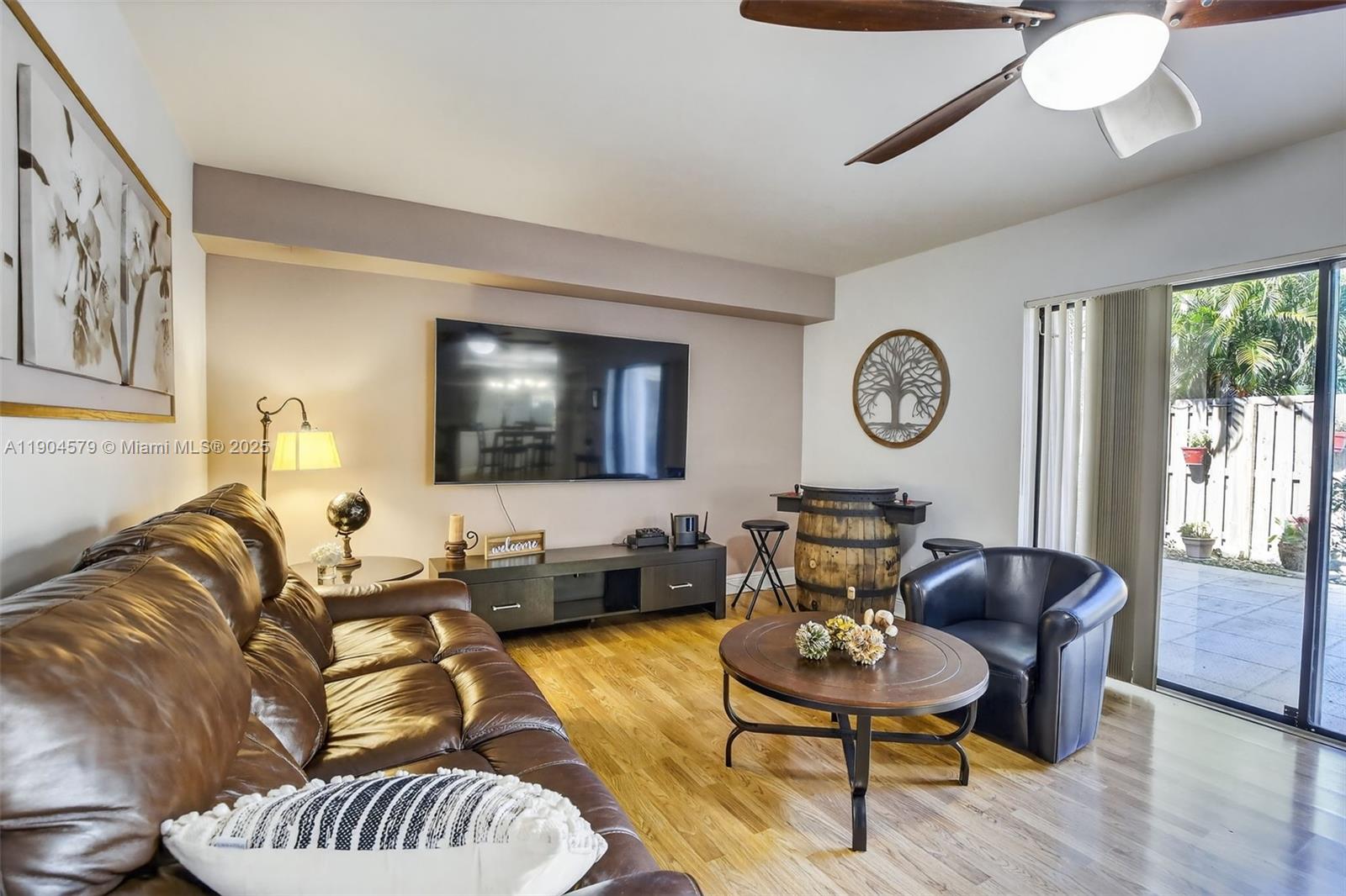 9927 Northwest 6th Place Plantation, FL 33324 - Photo 4 of 43 a living room with furniture and a flat screen tv