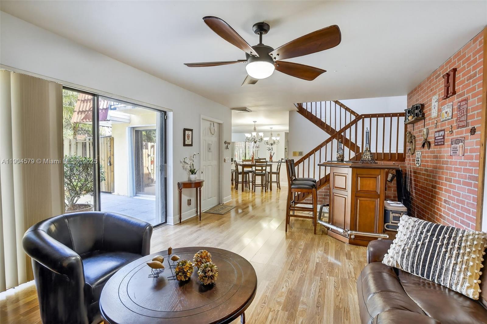 9927 Northwest 6th Place Plantation, FL 33324 - Photo 5 of 43 a living room with furniture and a wooden floor