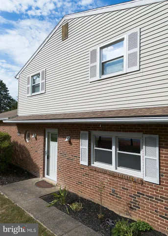 a view of a pool with a yard