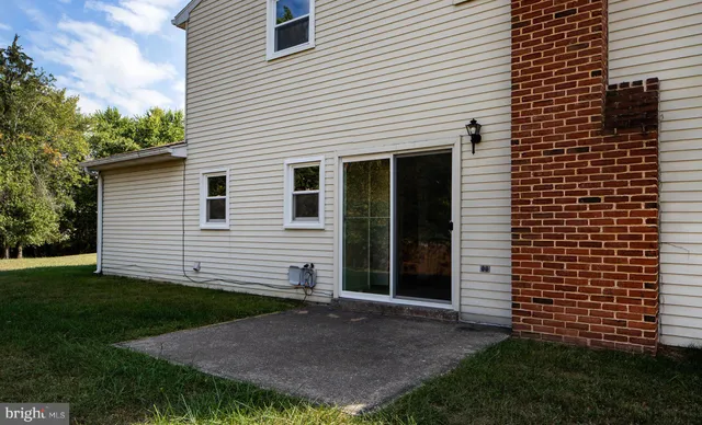 a kitchen with a sink a refrigerator and cabinets