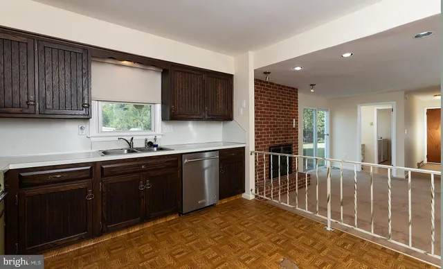 a view of hallway with wooden floor