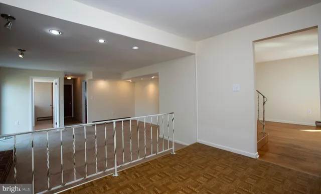 a kitchen with wooden cabinets and stainless steel appliances