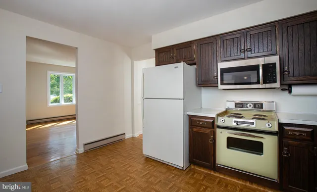 a view of an empty room with a fireplace