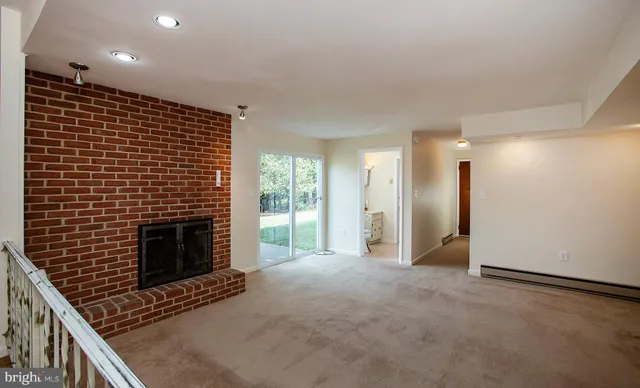 a view of a kitchen with a sink and cabinets