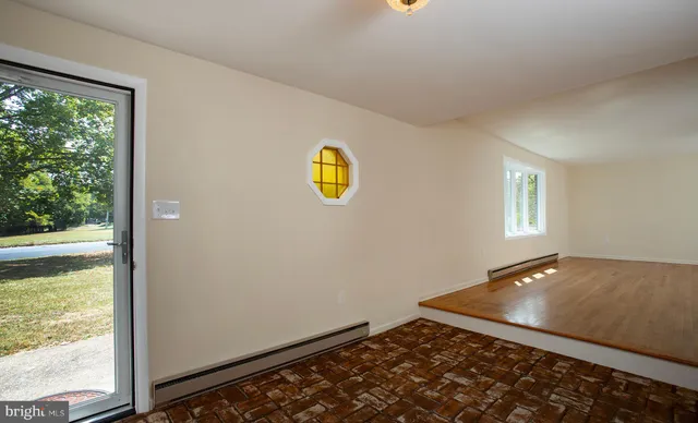 a view of an empty room with windows