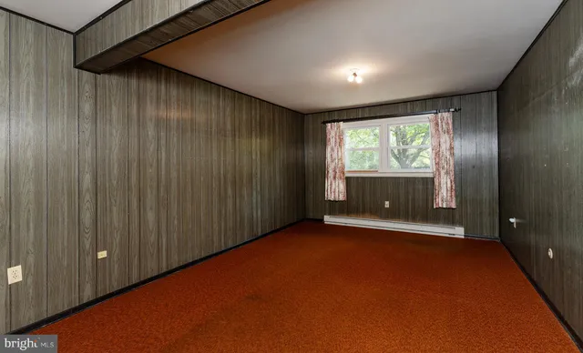 a bathroom with a sink toilet and window