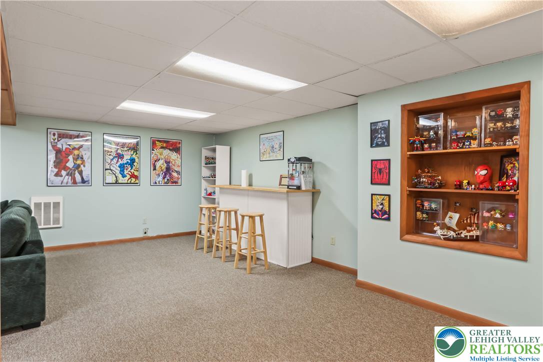 1322 Valley Road Bethlehem, PA 18018 - Photo 20 of 32 A Bar area and shelving grace the far side of the huge living space