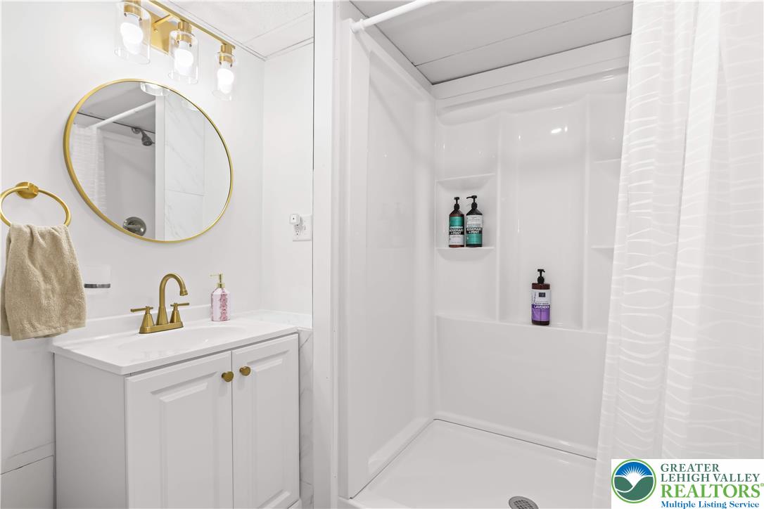 1322 Valley Road Bethlehem, PA 18018 - Photo 23 of 32 Oversized Shower, gold fixtures, tile flooring