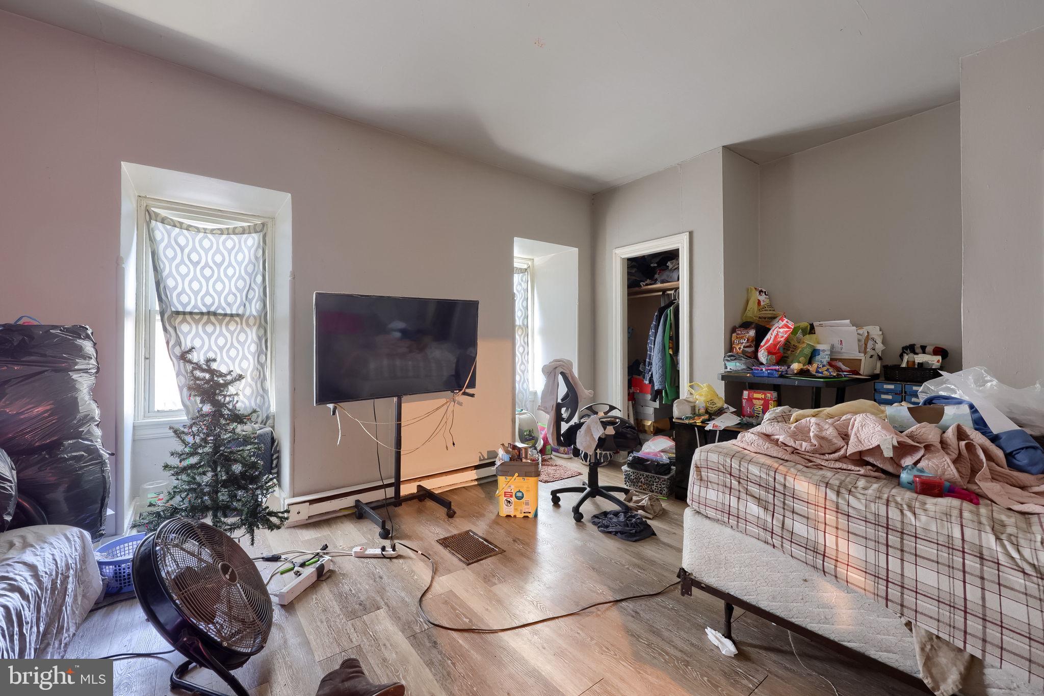 512 Spruce Street Lebanon, PA 17046 - Photo 15 of 23 a living room with furniture a flat screen tv and a window
