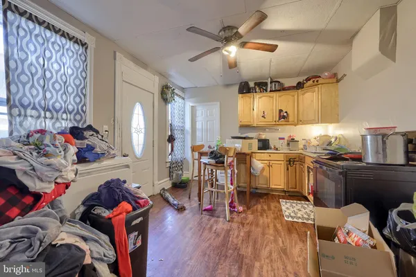 a kitchen with a sink appliances and cabinets